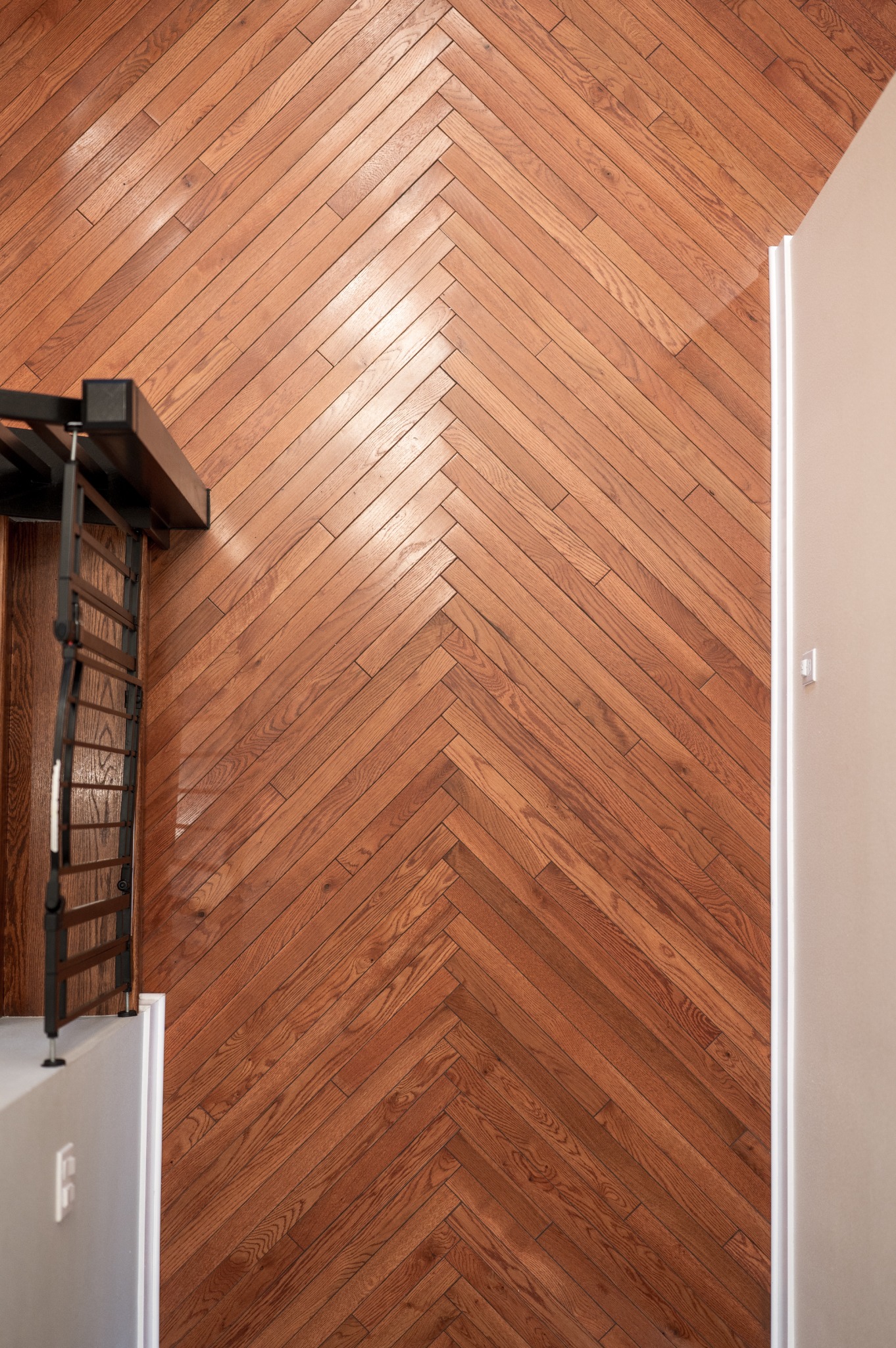 Herringbone red oak flooring at the entry